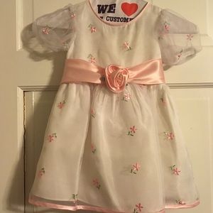 Child’s white dress with pink flowers